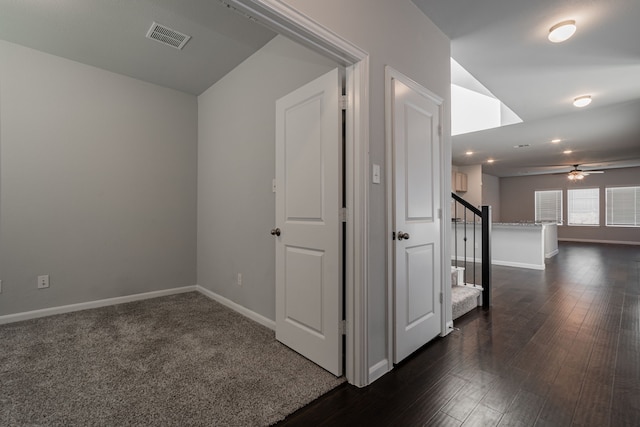 hallway with dark wood-type flooring