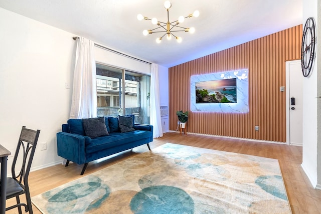 living room with light hardwood / wood-style floors and a chandelier