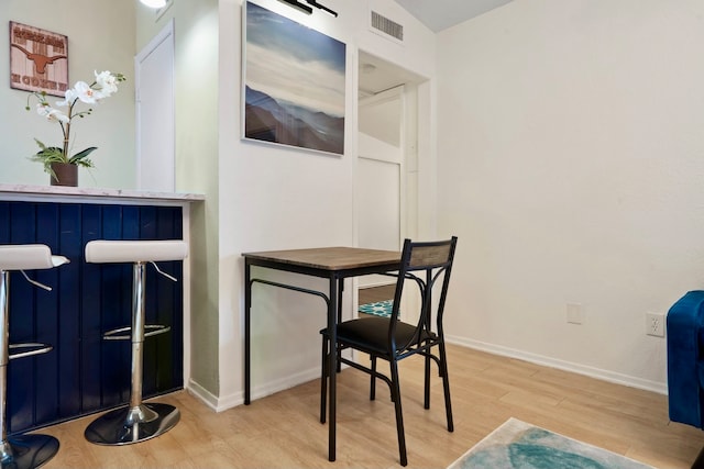 dining room with light hardwood / wood-style flooring