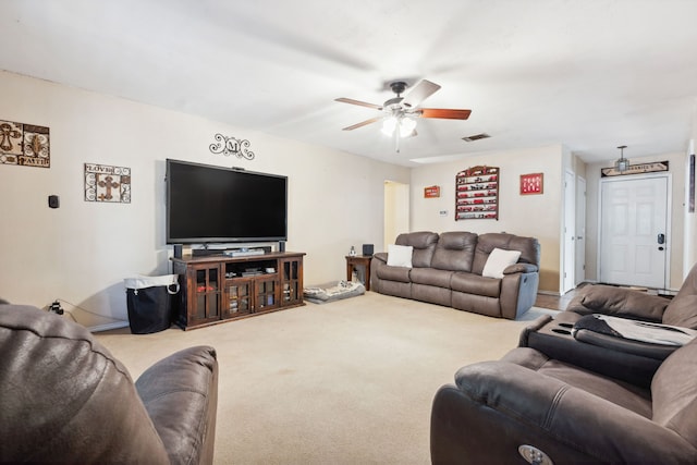 living room featuring carpet floors and ceiling fan