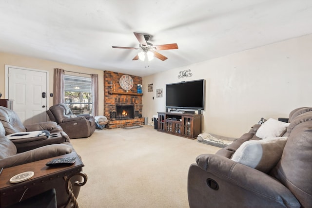 living room with a fireplace, ceiling fan, and carpet flooring