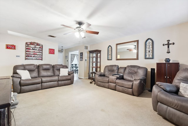 living room featuring light colored carpet and ceiling fan