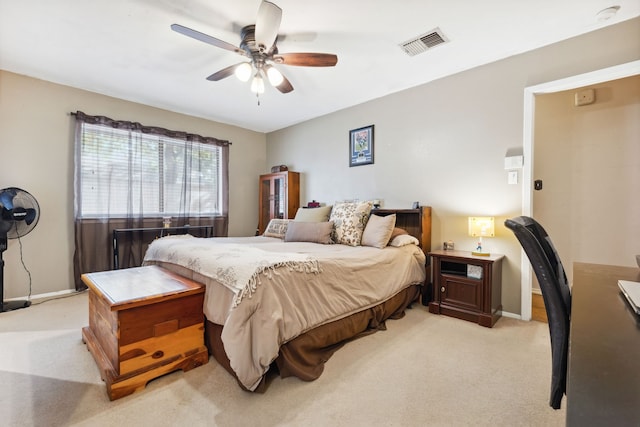 bedroom with ceiling fan and light colored carpet