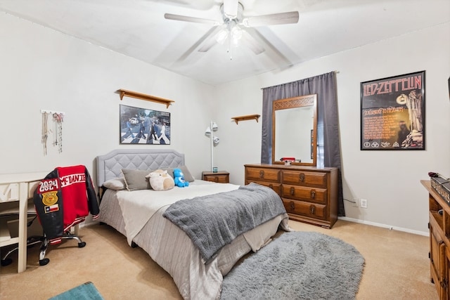 bedroom featuring light carpet and ceiling fan