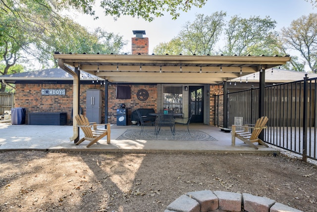 back of house with a patio