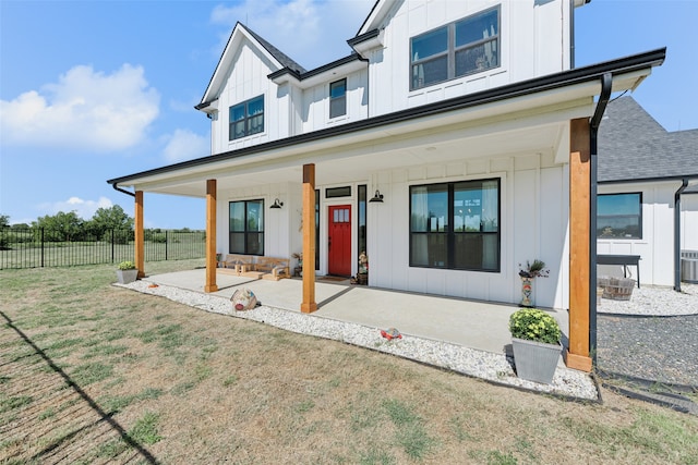 modern inspired farmhouse with a front yard