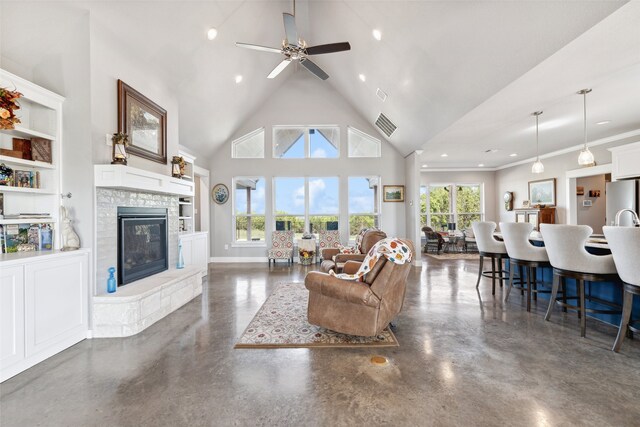 living room featuring high vaulted ceiling, ceiling fan, a fireplace, built in features, and ornamental molding