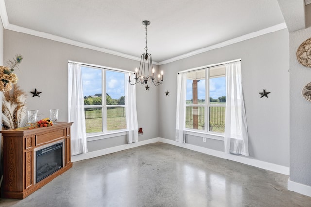 interior space featuring crown molding, plenty of natural light, a chandelier, and concrete floors