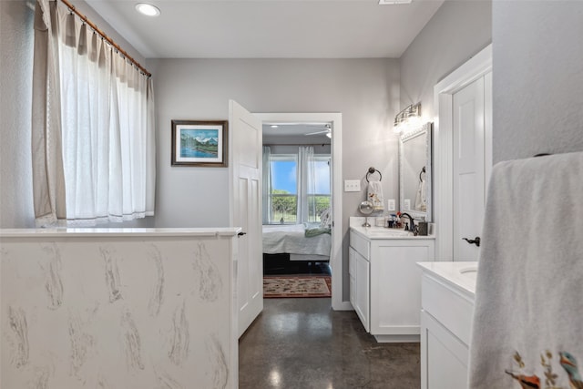 bathroom with concrete flooring, vanity, and ceiling fan