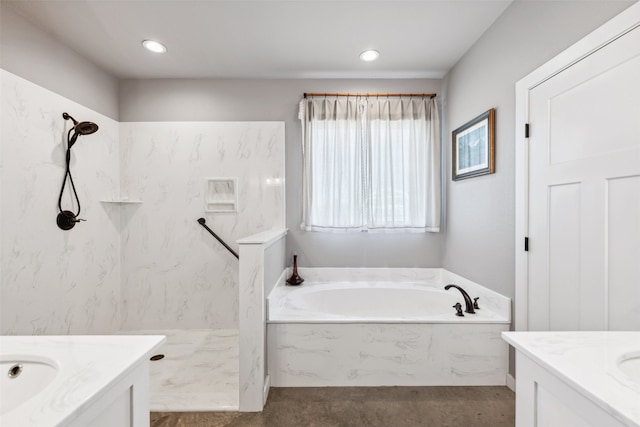 bathroom with vanity and separate shower and tub