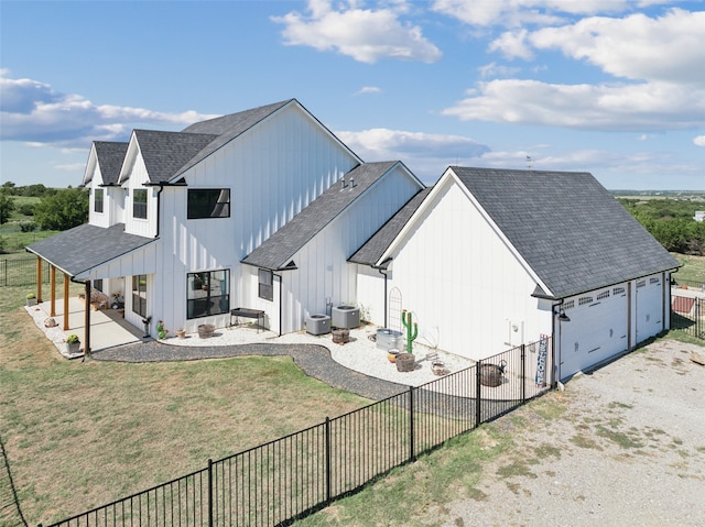 exterior space featuring a lawn and central AC unit