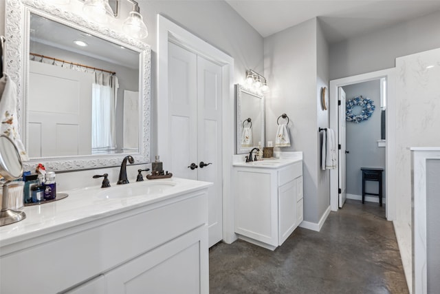 bathroom with vanity and concrete floors