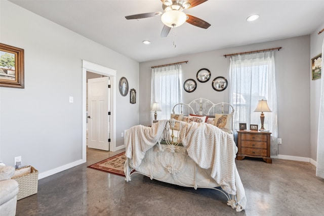 bedroom with multiple windows and ceiling fan