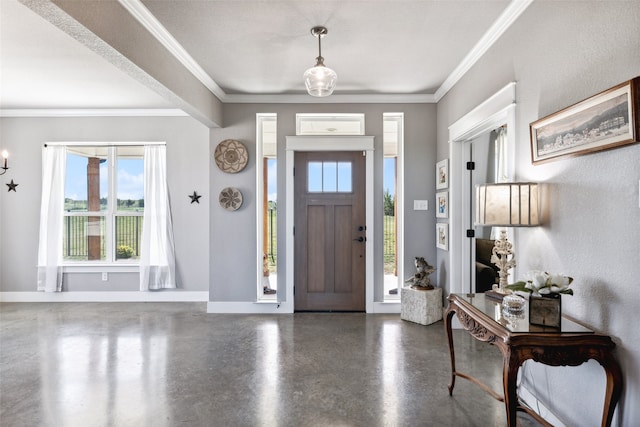 foyer entrance featuring crown molding