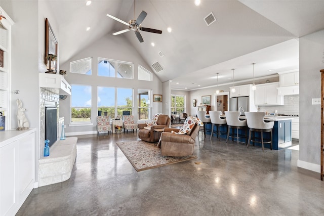 living room with high vaulted ceiling and ceiling fan