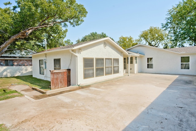 back of property with a patio area