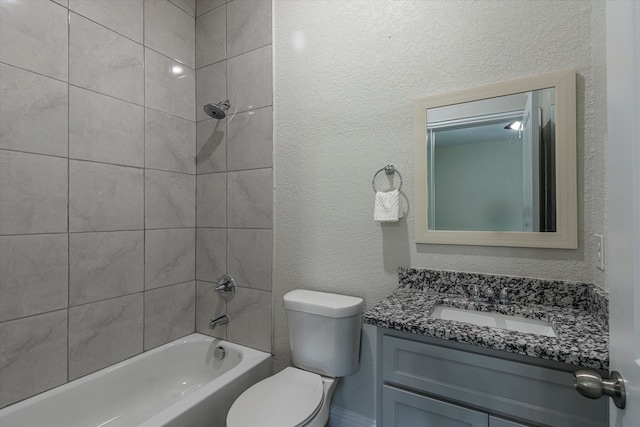 full bathroom with toilet, vanity, and tiled shower / bath combo