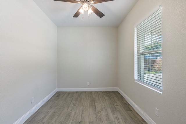 empty room featuring ceiling fan and hardwood / wood-style floors