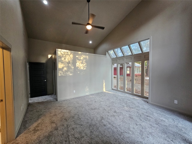 interior space with high vaulted ceiling, ceiling fan, and carpet