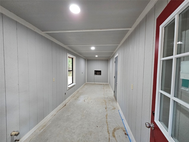 interior space featuring wood walls