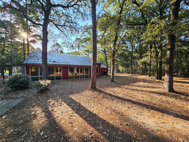 exterior space featuring a sunroom