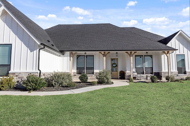 back of property featuring a lawn and a porch