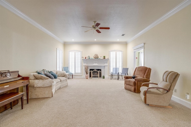 carpeted living room with crown molding, a textured ceiling, and ceiling fan