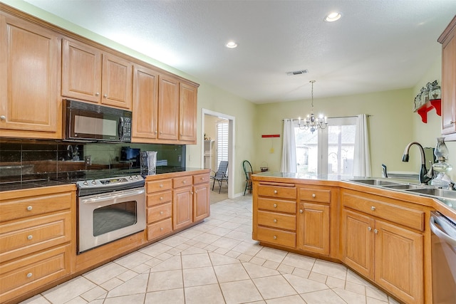 kitchen with sink, light tile patterned flooring, a notable chandelier, and stainless steel appliances