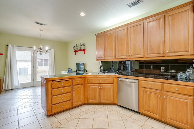 kitchen featuring light tile patterned flooring, kitchen peninsula, stainless steel dishwasher, decorative backsplash, and an inviting chandelier