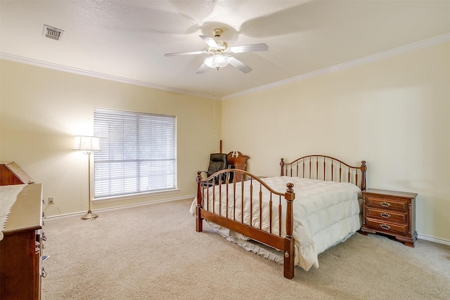 carpeted bedroom with crown molding and ceiling fan