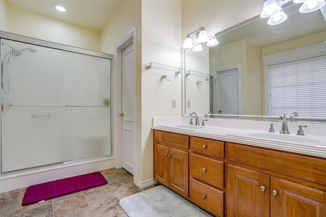 bathroom with vanity and an enclosed shower