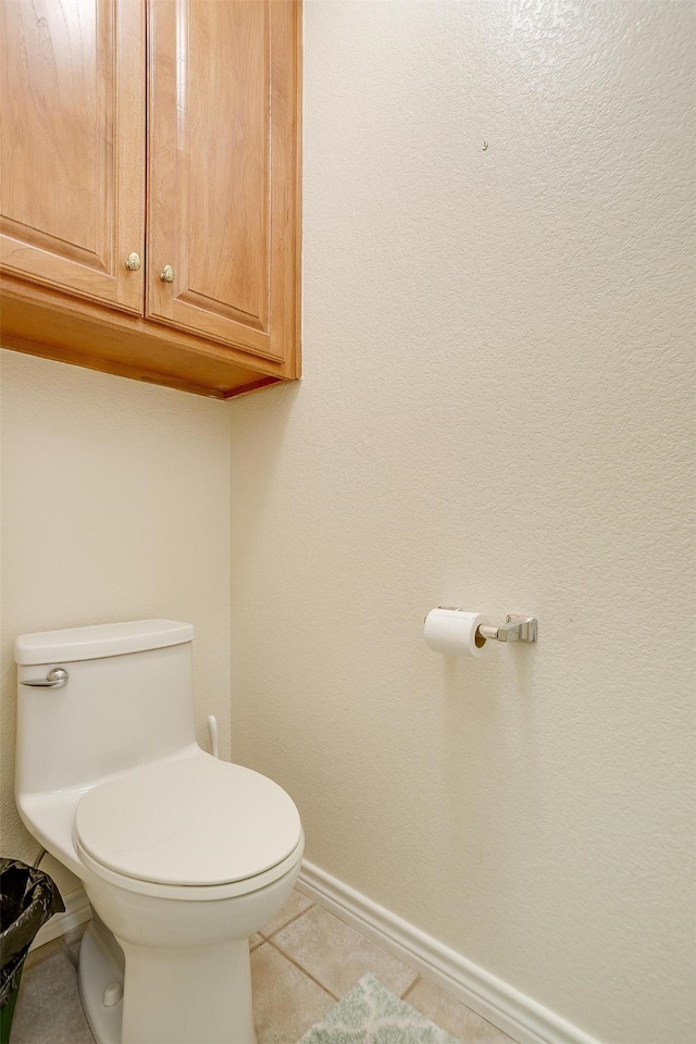 bathroom with tile patterned floors and toilet