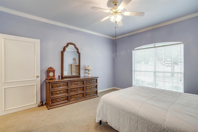 bedroom featuring ornamental molding, carpet, and ceiling fan