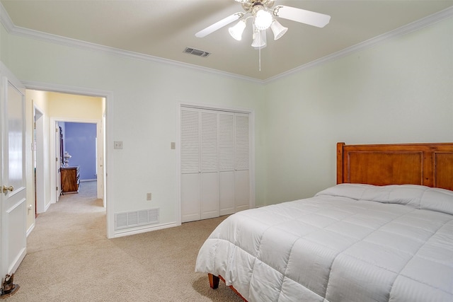 carpeted bedroom featuring a closet, ceiling fan, and crown molding