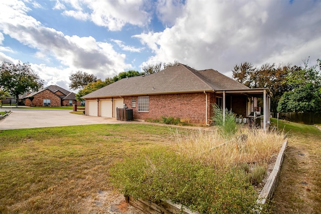 view of property exterior featuring a yard and a garage