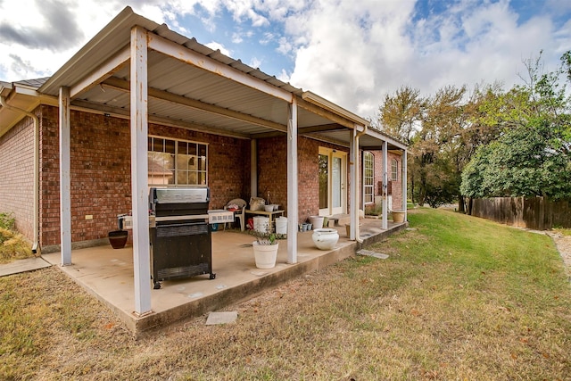 exterior space with a grill