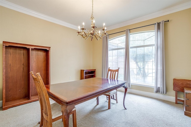 carpeted dining area with crown molding, a wealth of natural light, and a chandelier