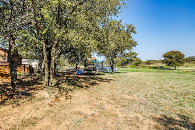 view of yard featuring a trampoline