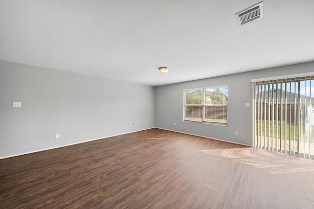 unfurnished room with wood-type flooring