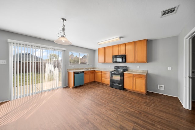 kitchen with black appliances, hanging light fixtures, and dark hardwood / wood-style flooring