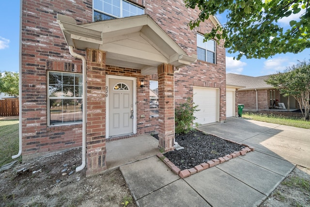 view of exterior entry featuring a garage