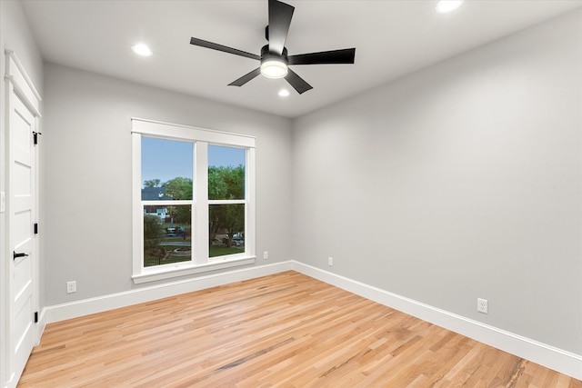 spare room with ceiling fan and light hardwood / wood-style floors