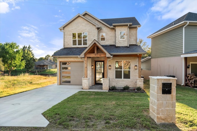 view of front of property featuring a front lawn and a garage