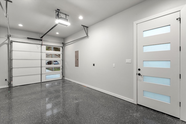 garage with electric panel and a garage door opener