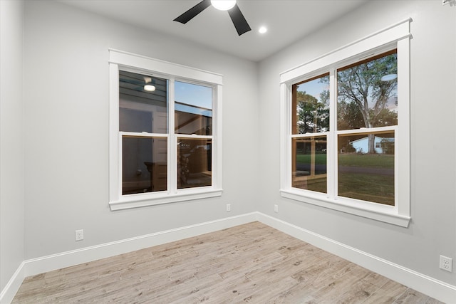 spare room with ceiling fan and light hardwood / wood-style floors