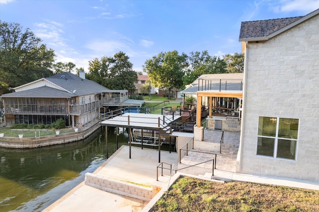 dock area with a deck with water view