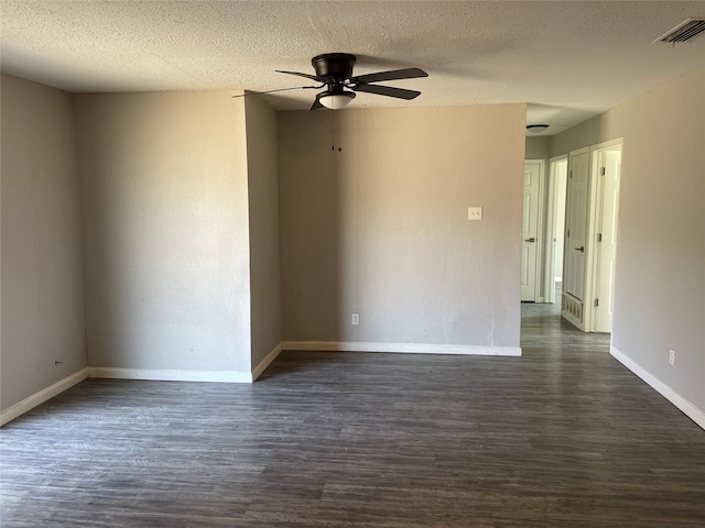 unfurnished room featuring ceiling fan, a textured ceiling, and dark hardwood / wood-style floors