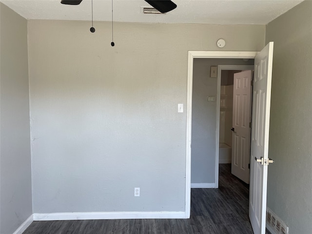 spare room with dark hardwood / wood-style floors