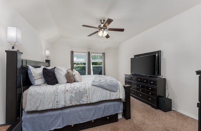 bedroom featuring light carpet, vaulted ceiling, and ceiling fan