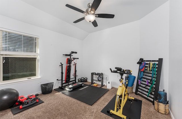 workout room featuring vaulted ceiling, carpet, and ceiling fan